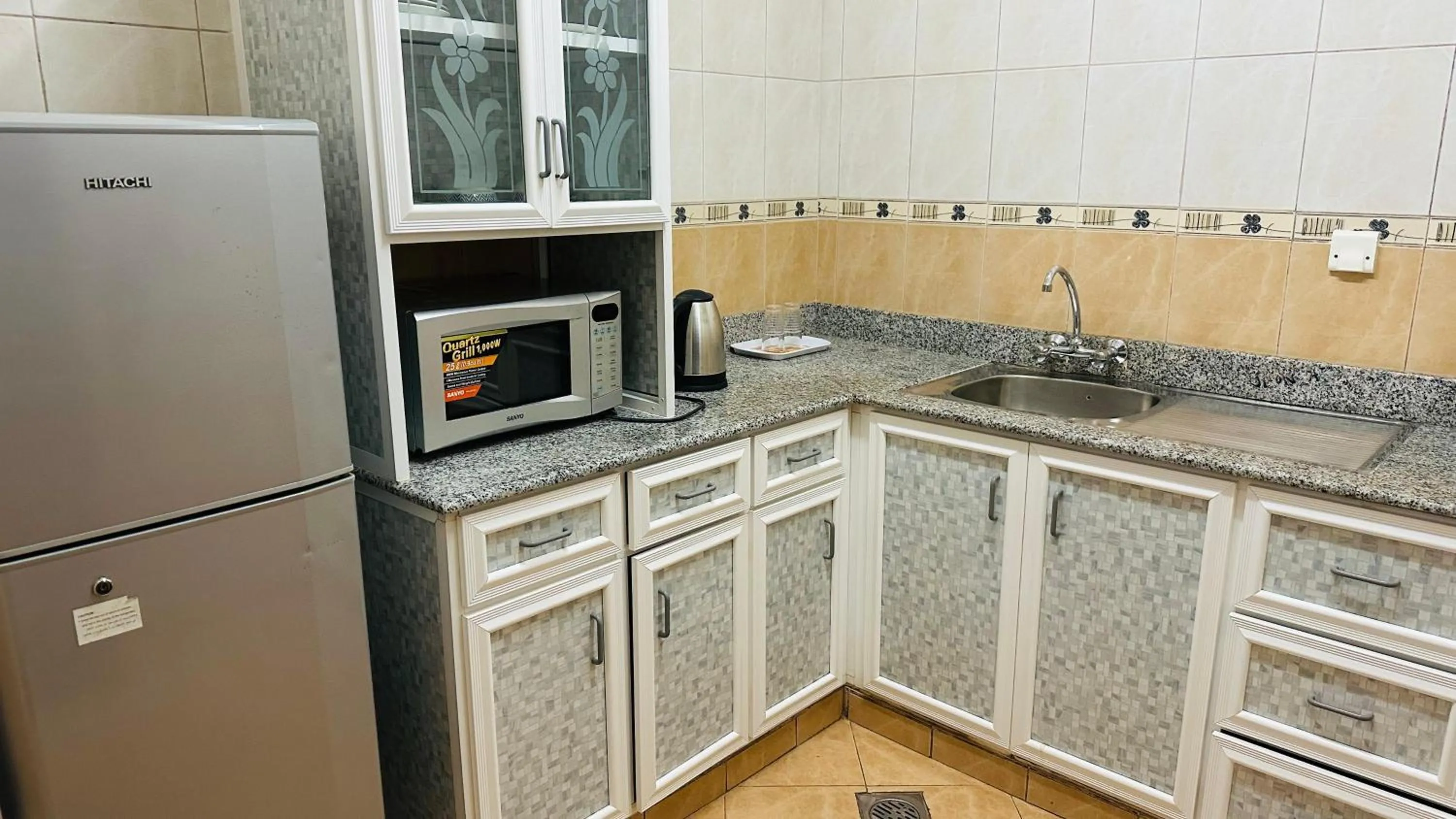 Kitchen or kitchenette in Dahlia Sohar Hotel Apartments