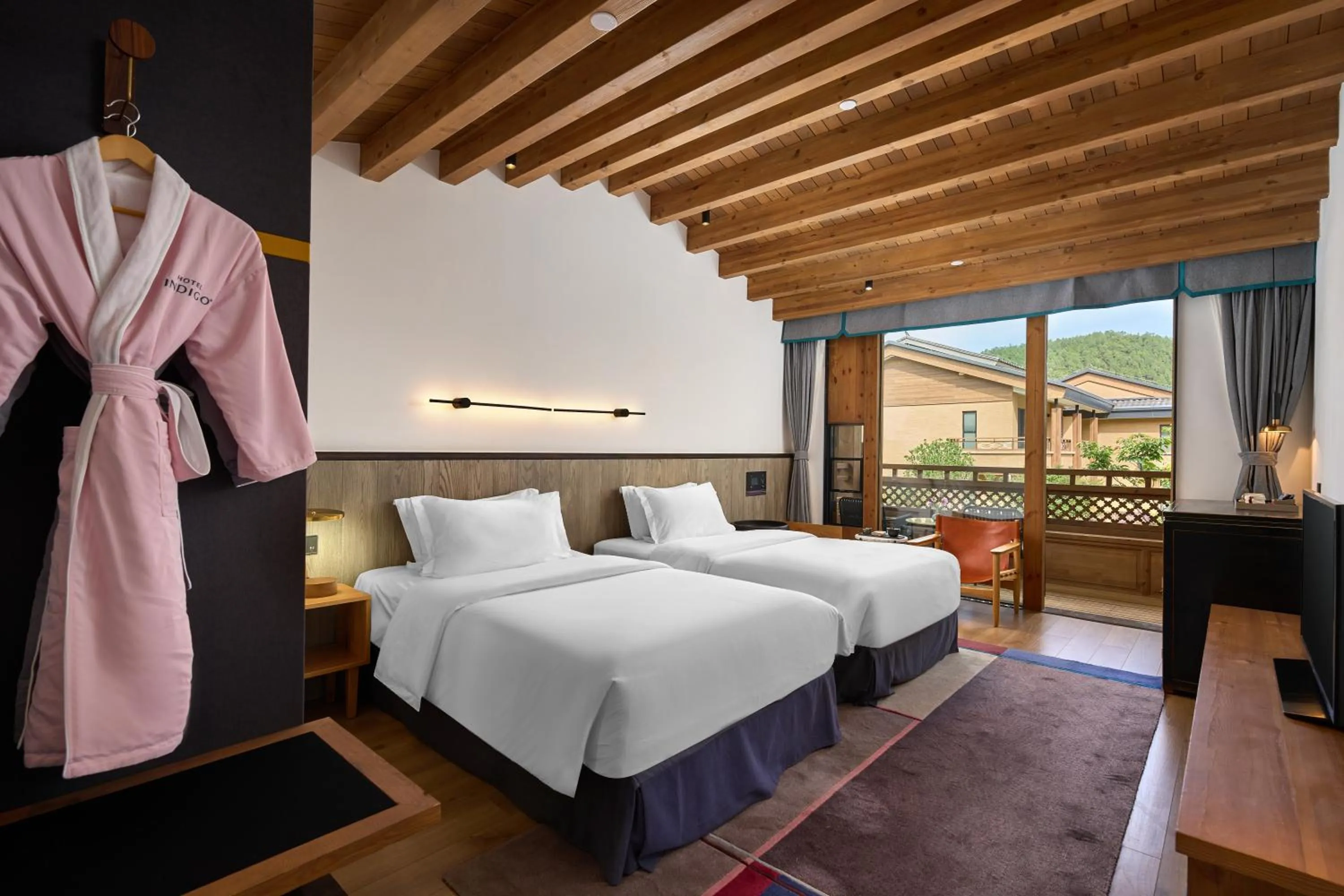 Bed in Hotel Indigo Lugu Lake by IHG