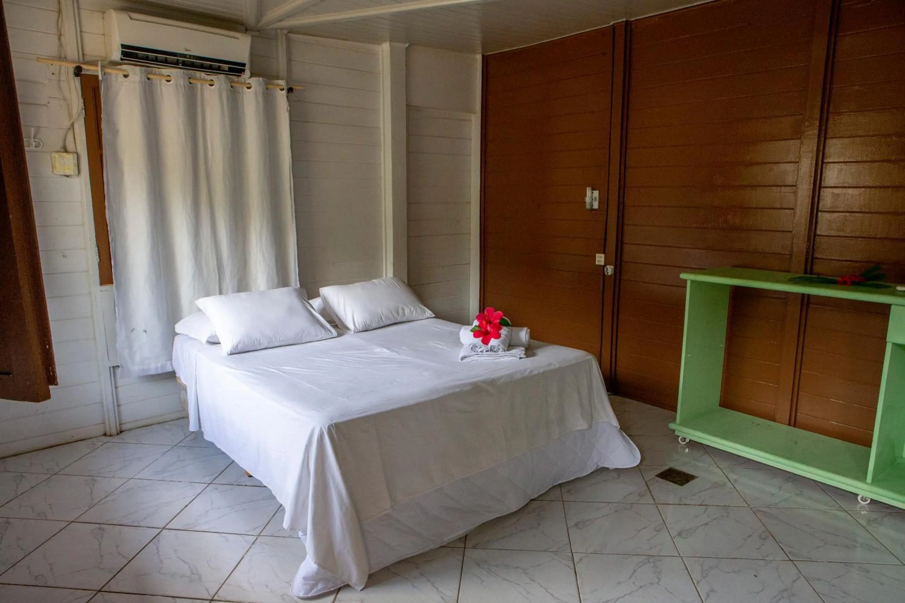 Bed in Pousada Sol e Mar Noronha