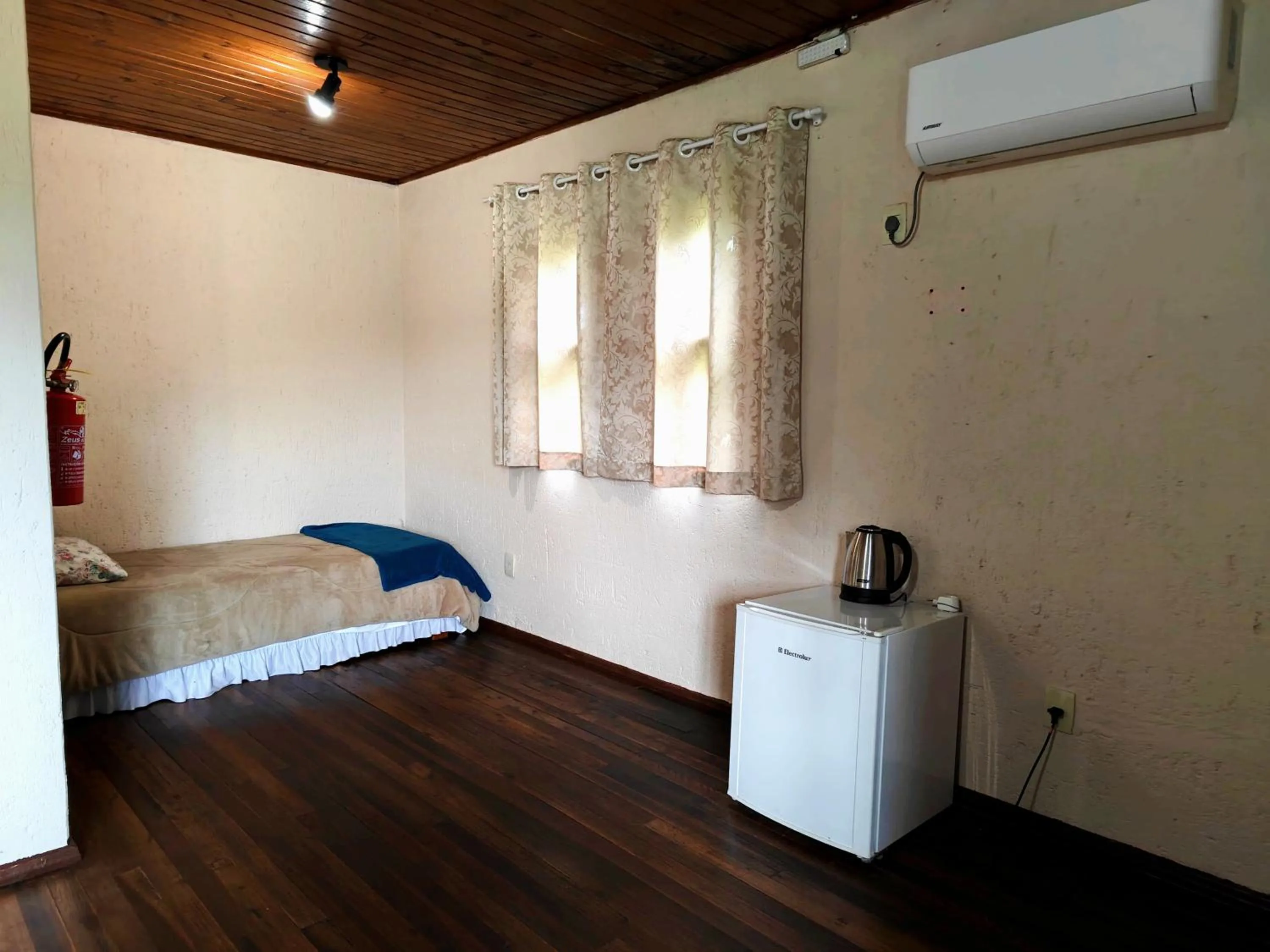 Bed in Chalés Pousada Malacara