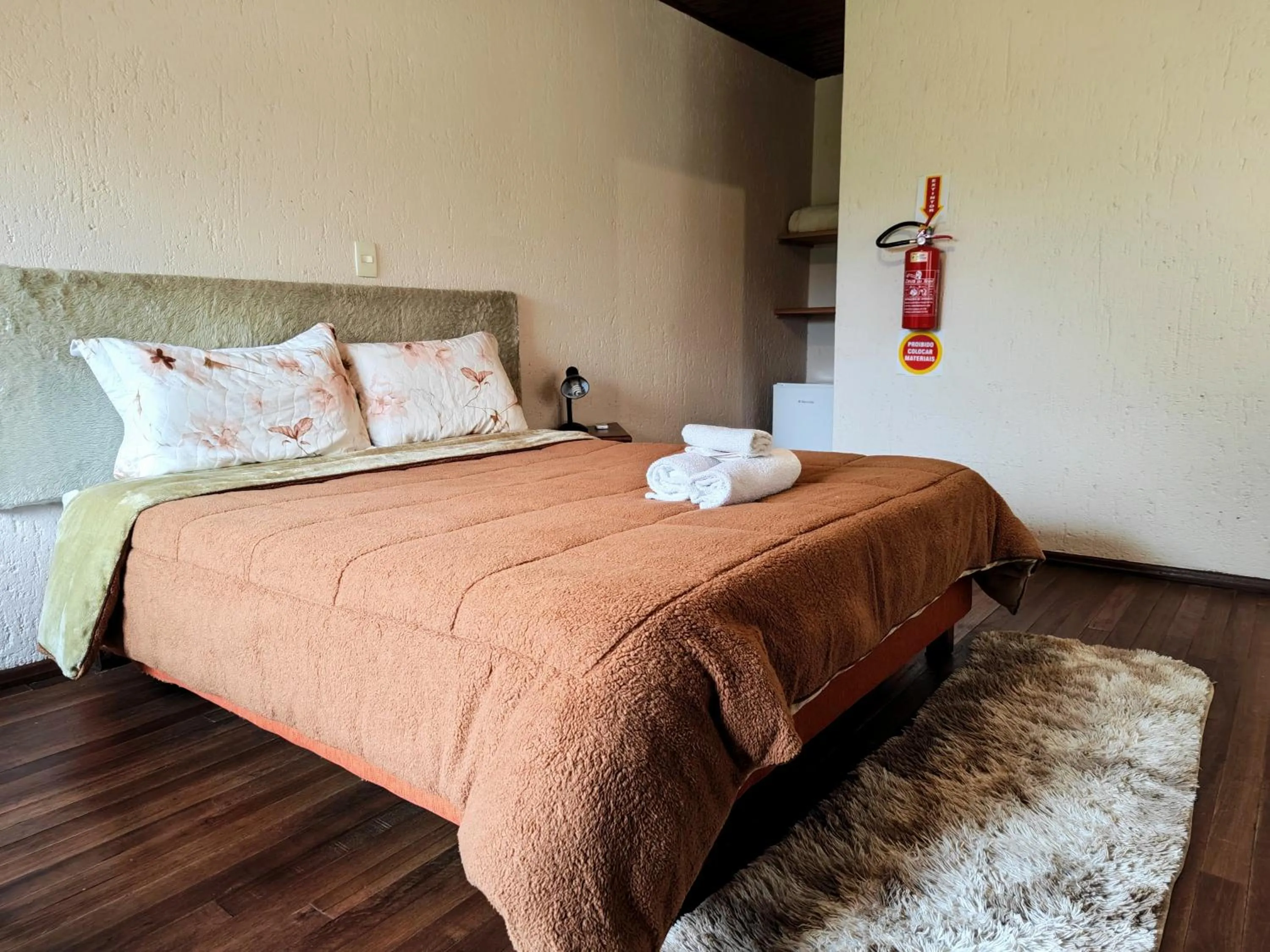 Bed in Chalés Pousada Malacara