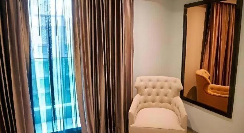 Bed in First Pride Hotel Bangkok