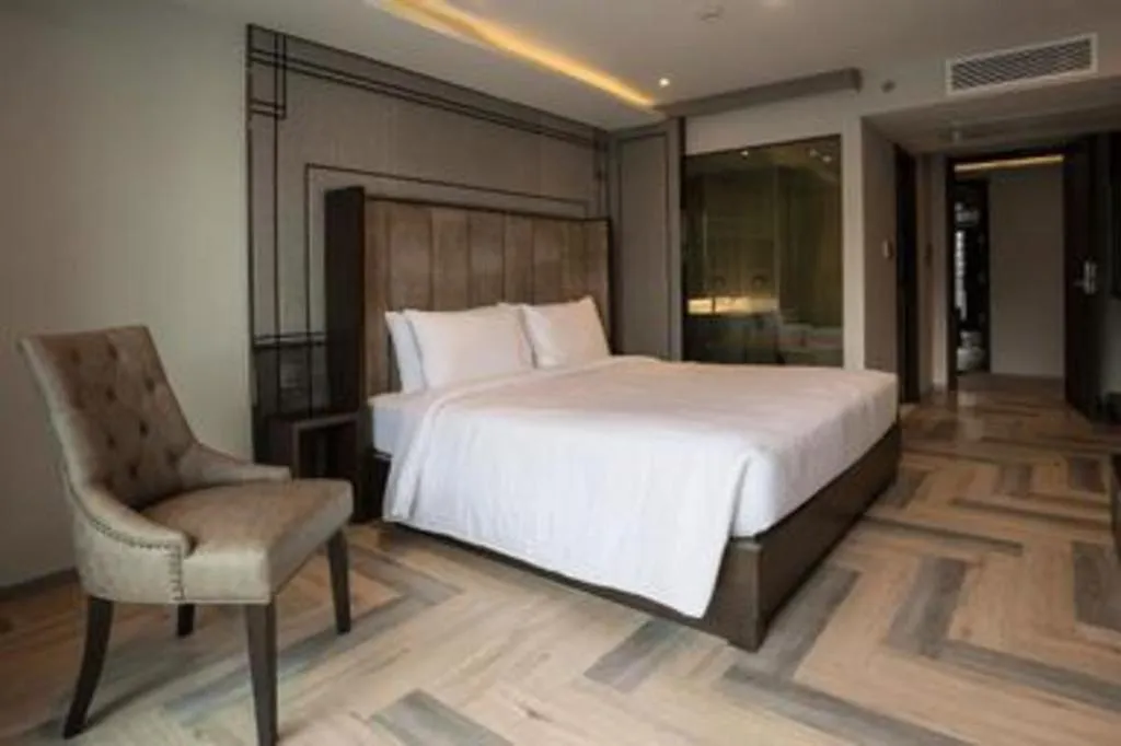 Bed in First Pride Hotel Bangkok