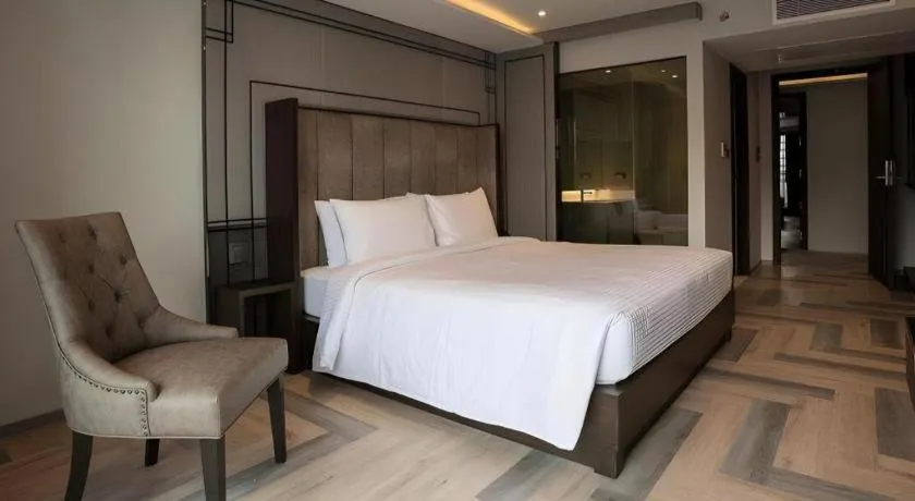 Bed in First Pride Hotel Bangkok