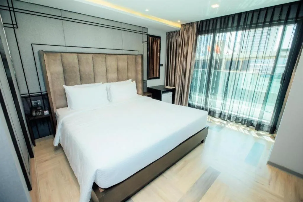 Bed in First Pride Hotel Bangkok