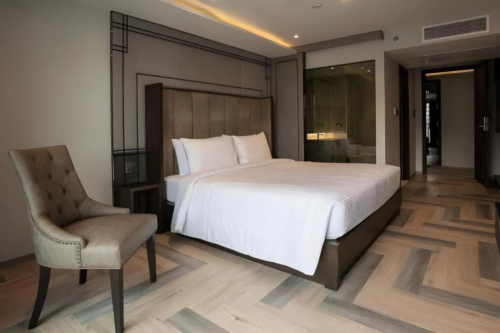 Bed in First Pride Hotel Bangkok