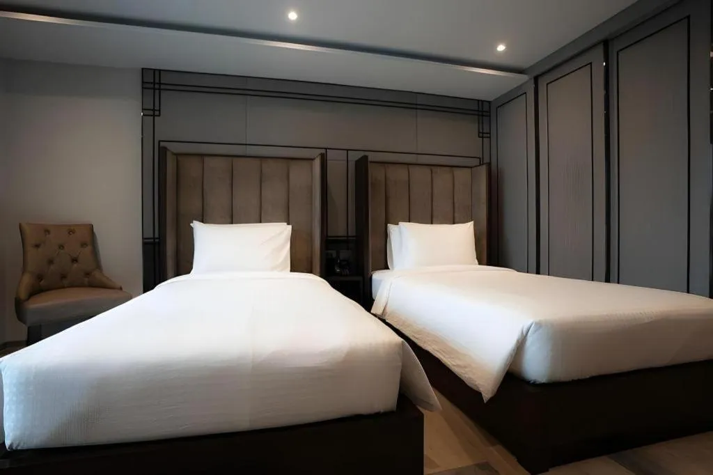 Bed in First Pride Hotel Bangkok