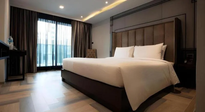 Bed in First Pride Hotel Bangkok