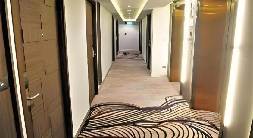 Bed in First Pride Hotel Bangkok