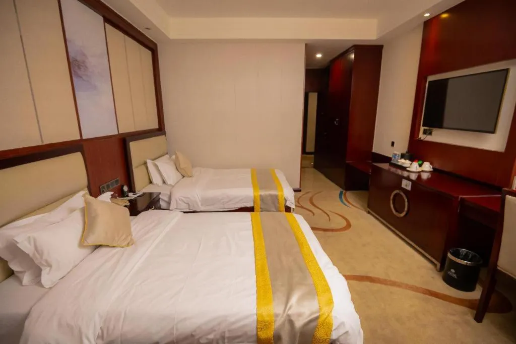 Bed in Grand Szechuan Hotel Vientiane