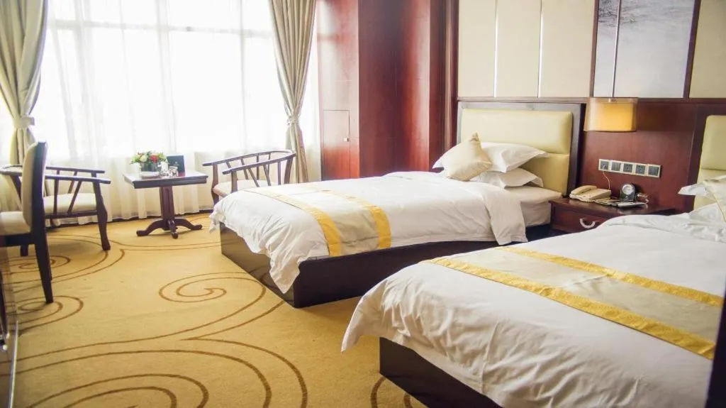 Bed in Grand Szechuan Hotel Vientiane