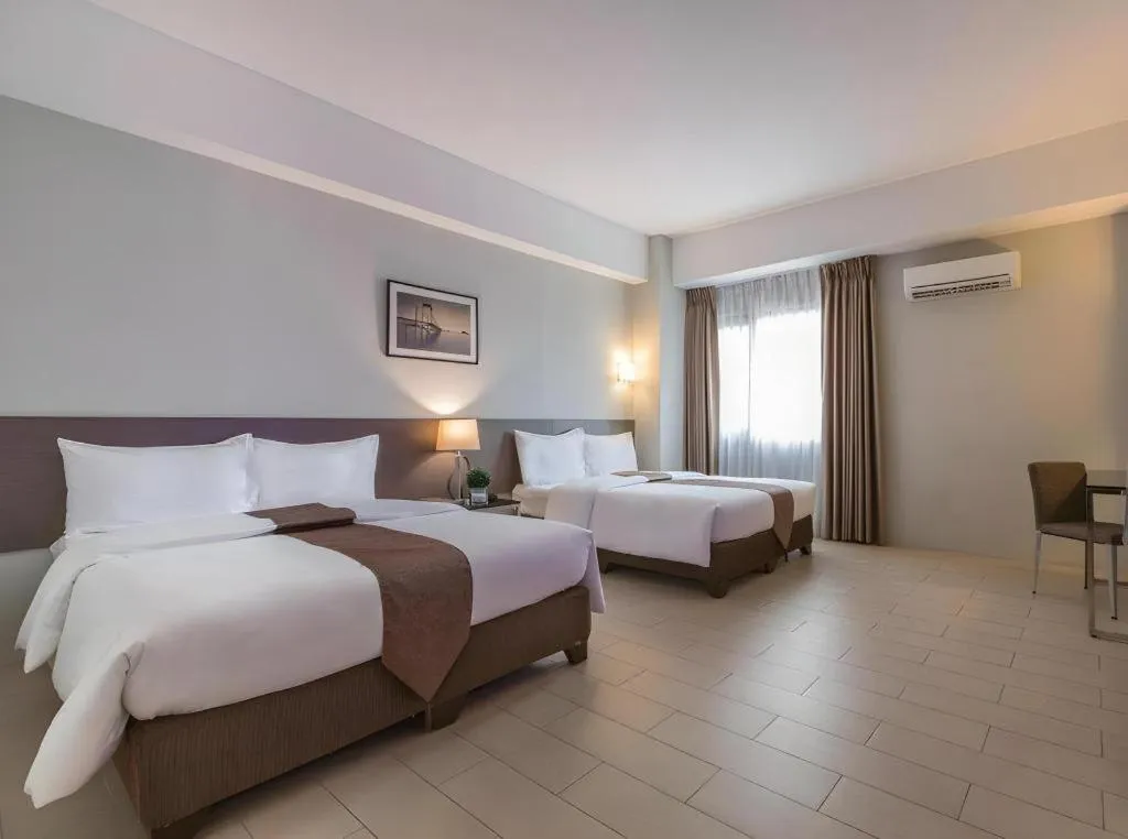 Bed in Sequoia Hotel Quezon City