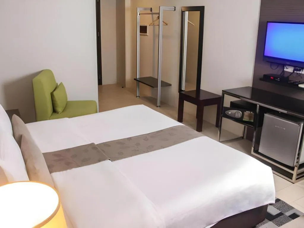 Bed in Sequoia Hotel Quezon City