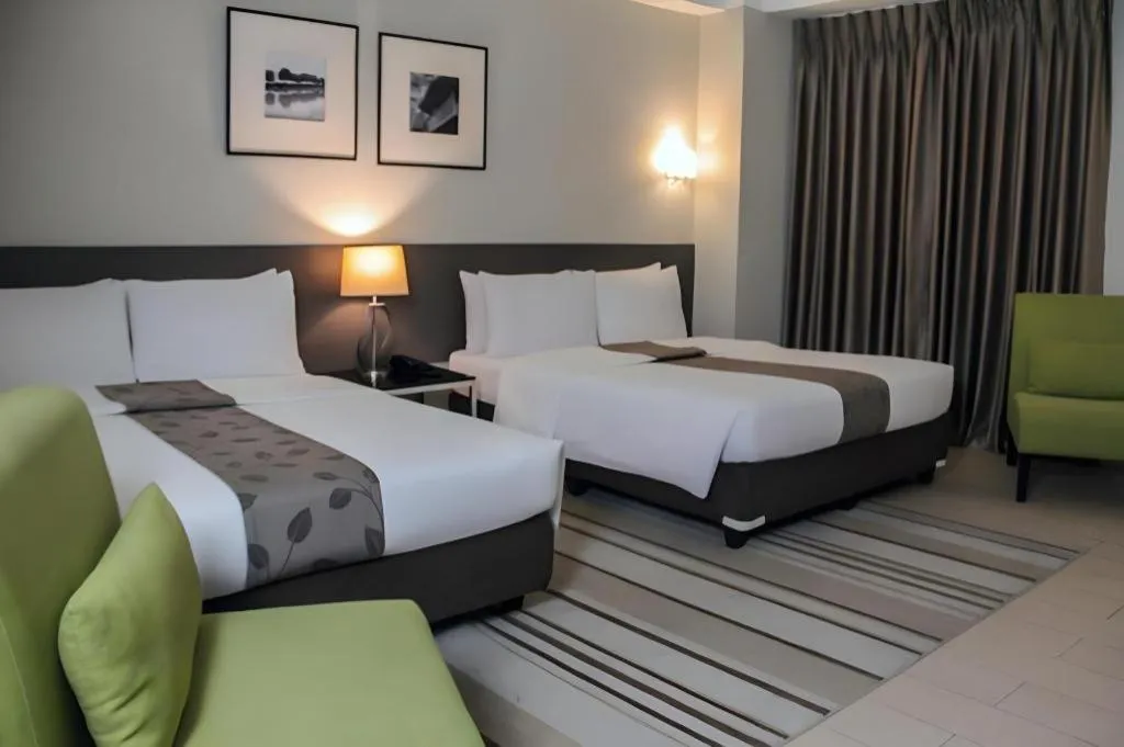 Bed in Sequoia Hotel Quezon City