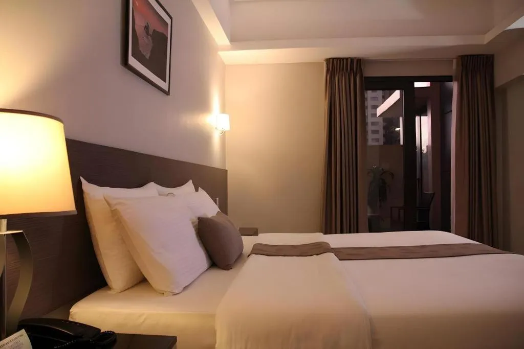 Bed in Sequoia Hotel Quezon City