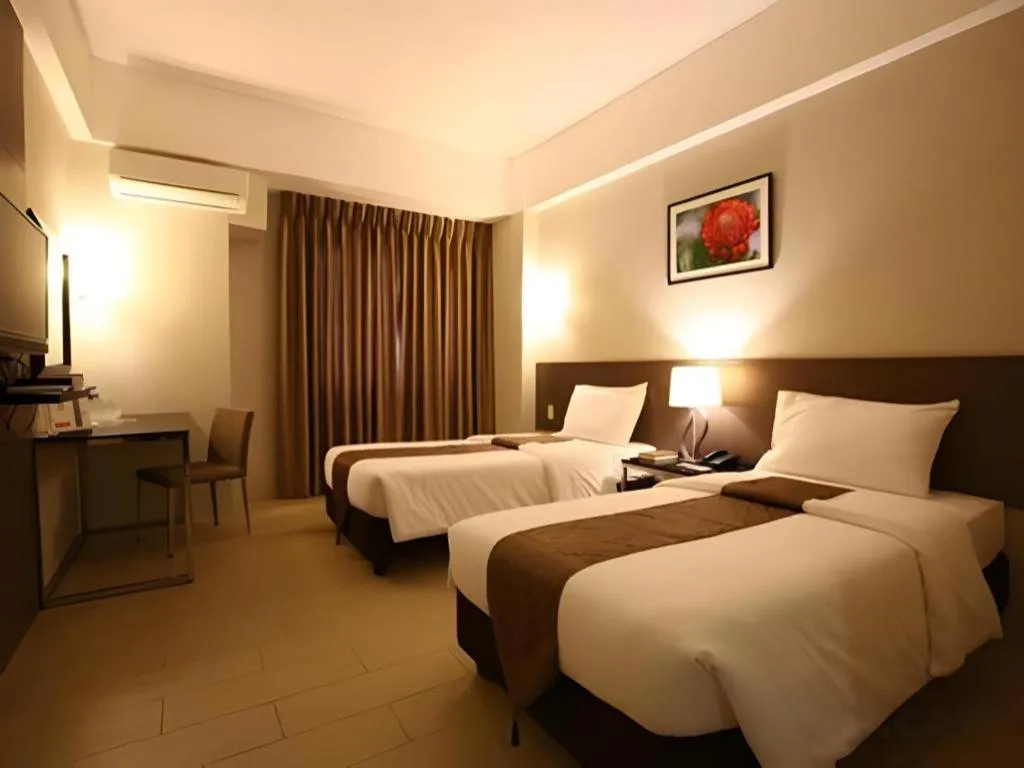 Bed in Sequoia Hotel Quezon City