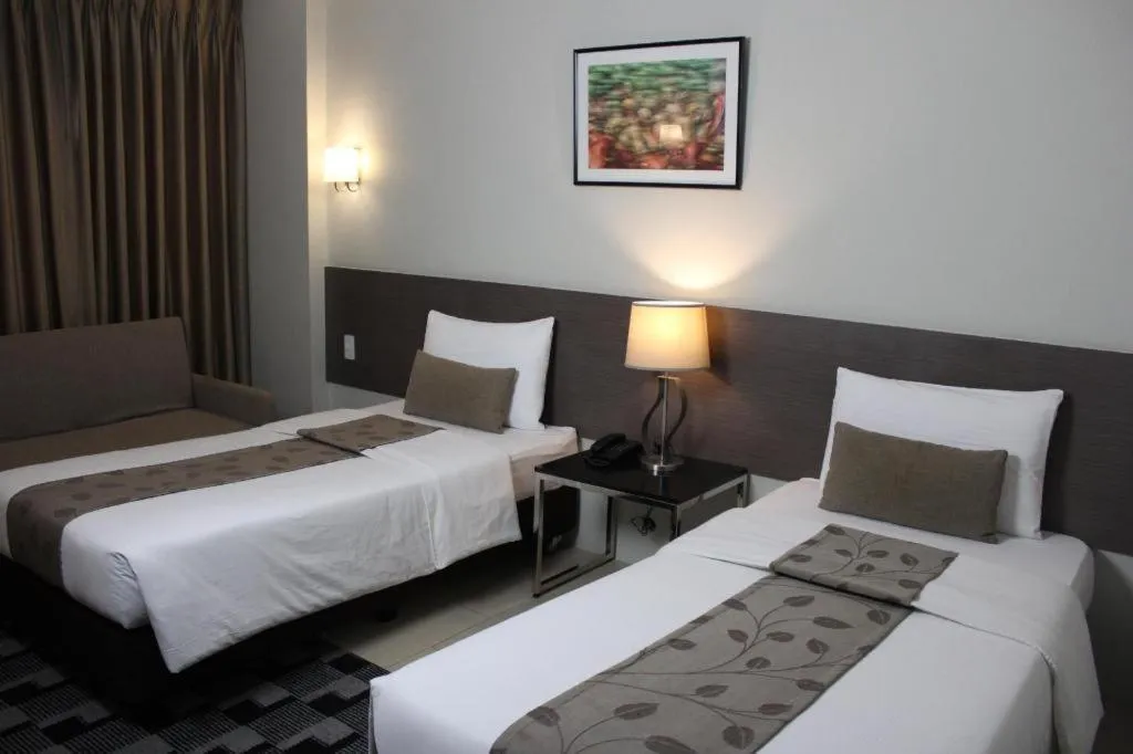 Bed in Sequoia Hotel Quezon City