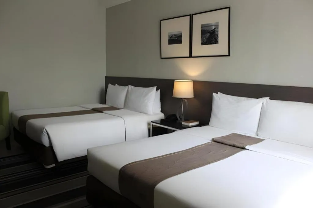 Bed in Sequoia Hotel Quezon City