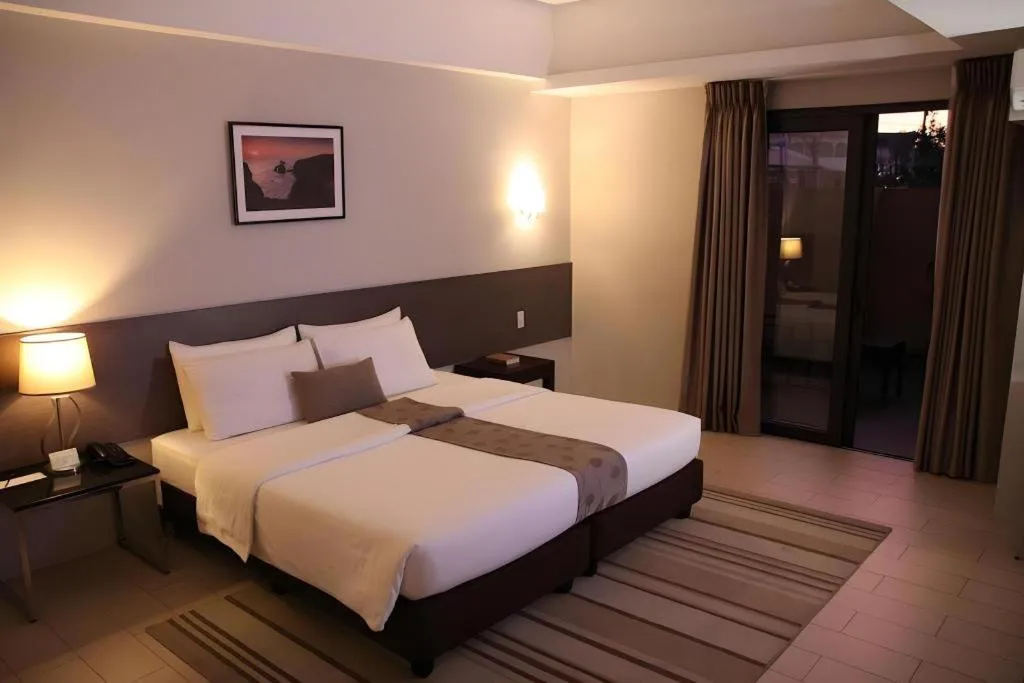 Bed in Sequoia Hotel Quezon City