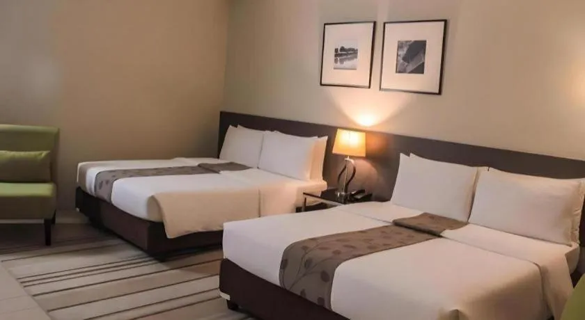 Bed in Sequoia Hotel Quezon City