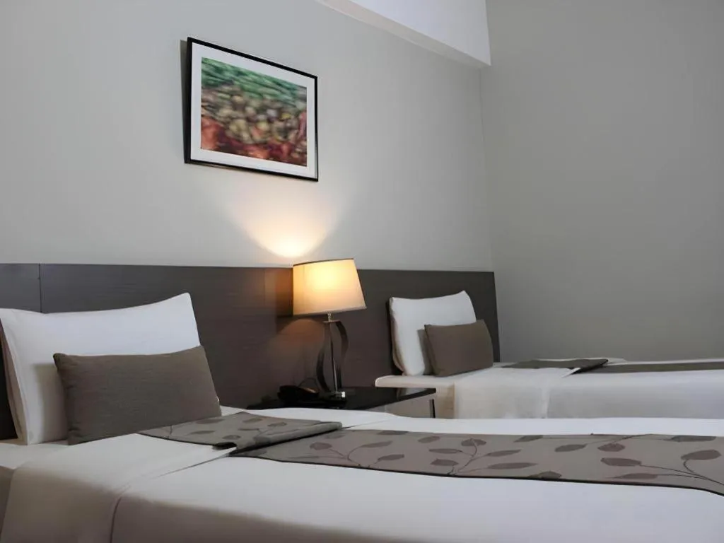 Bed in Sequoia Hotel Quezon City