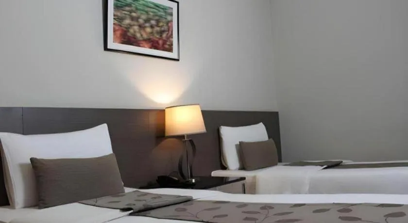 Bed in Sequoia Hotel Quezon City