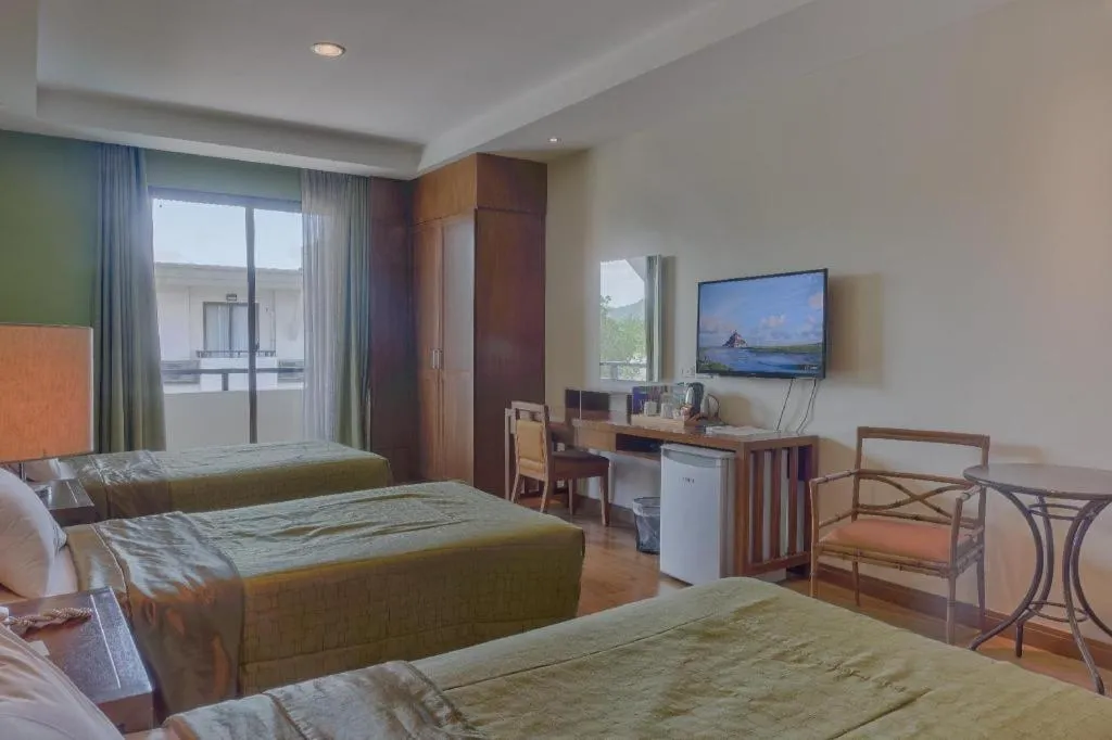 Bed in Mansion Garden Hotel