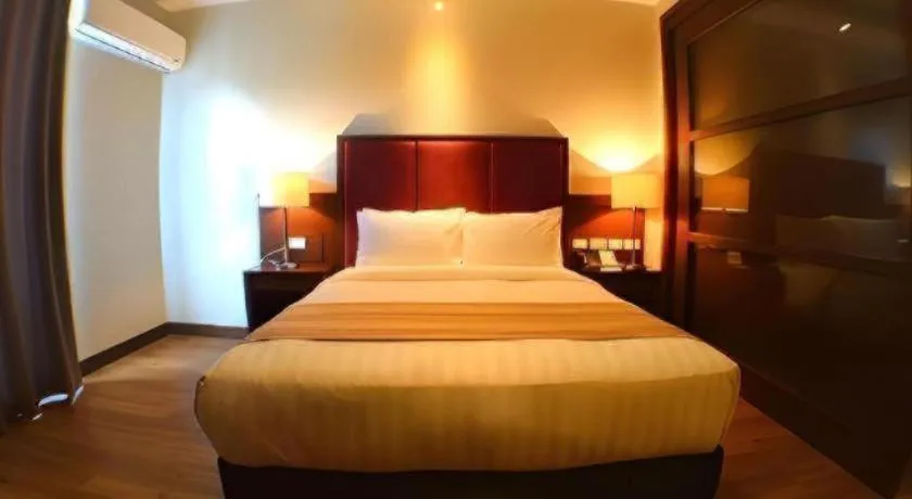 Bed in Mansion Garden Hotel