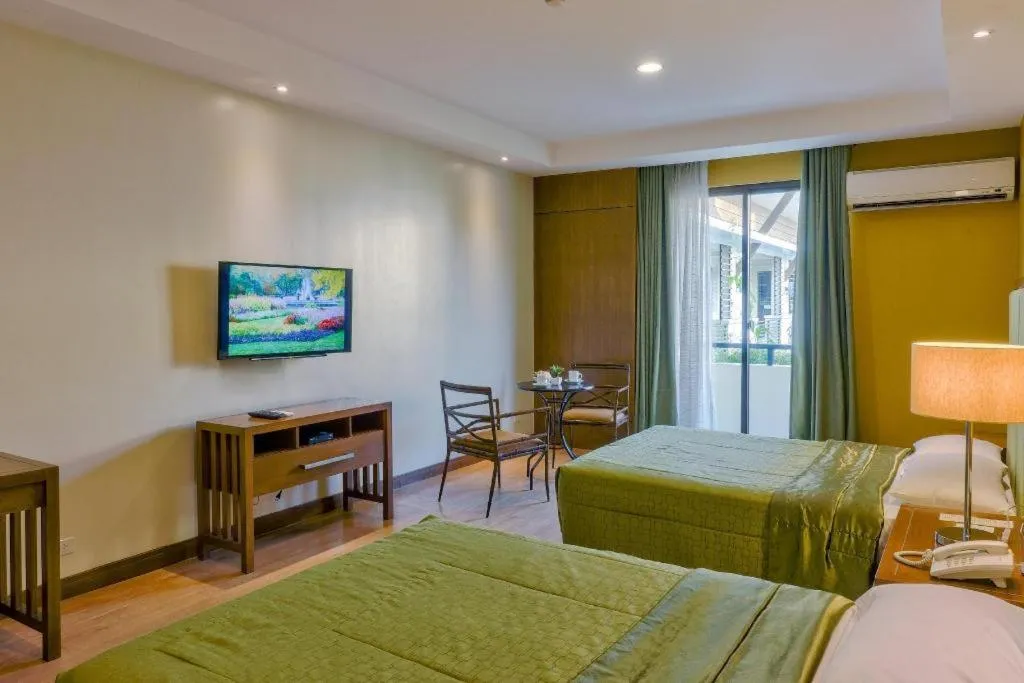 Bed in Mansion Garden Hotel