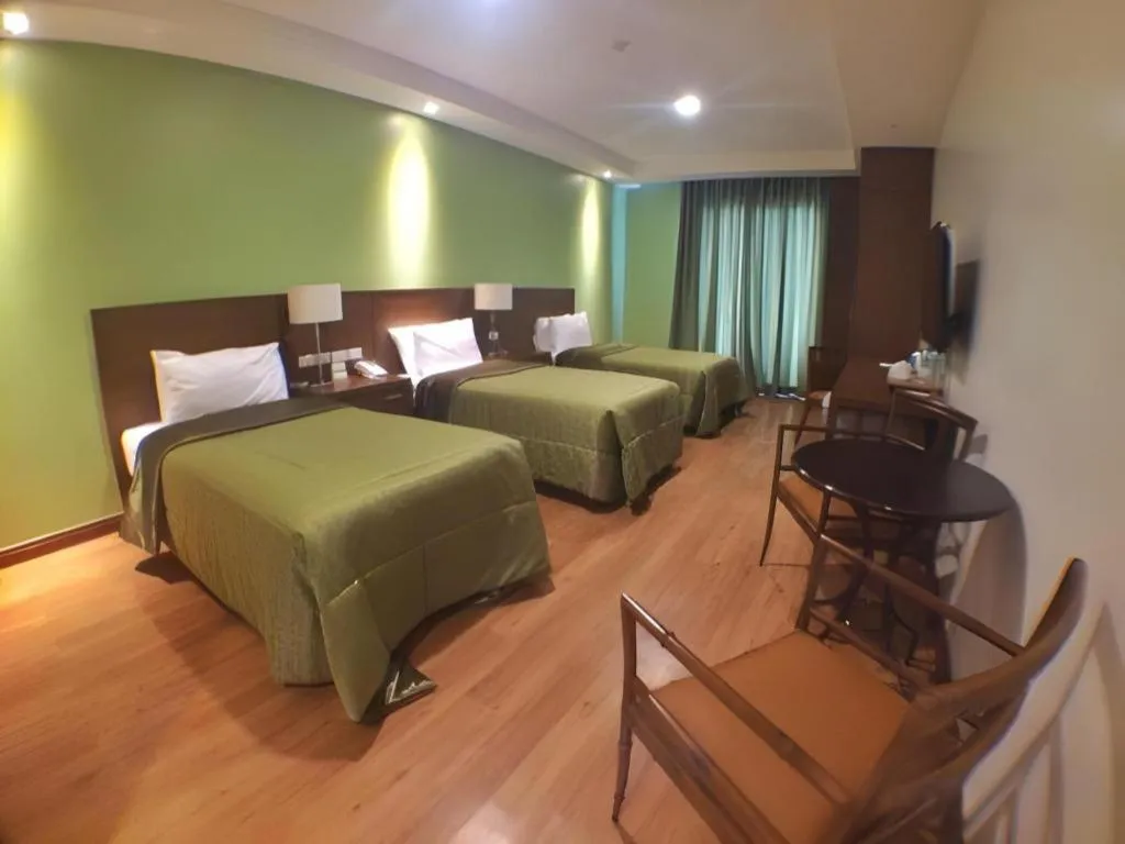 Bed in Mansion Garden Hotel