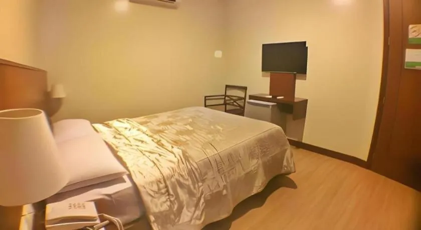 Bed in Mansion Garden Hotel