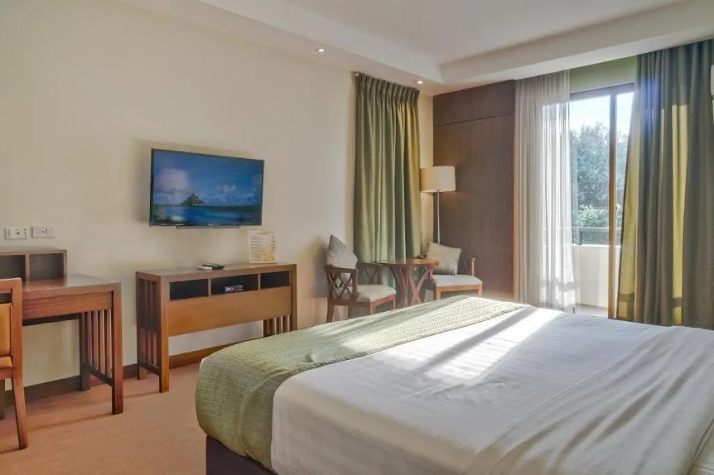 Bed in Mansion Garden Hotel