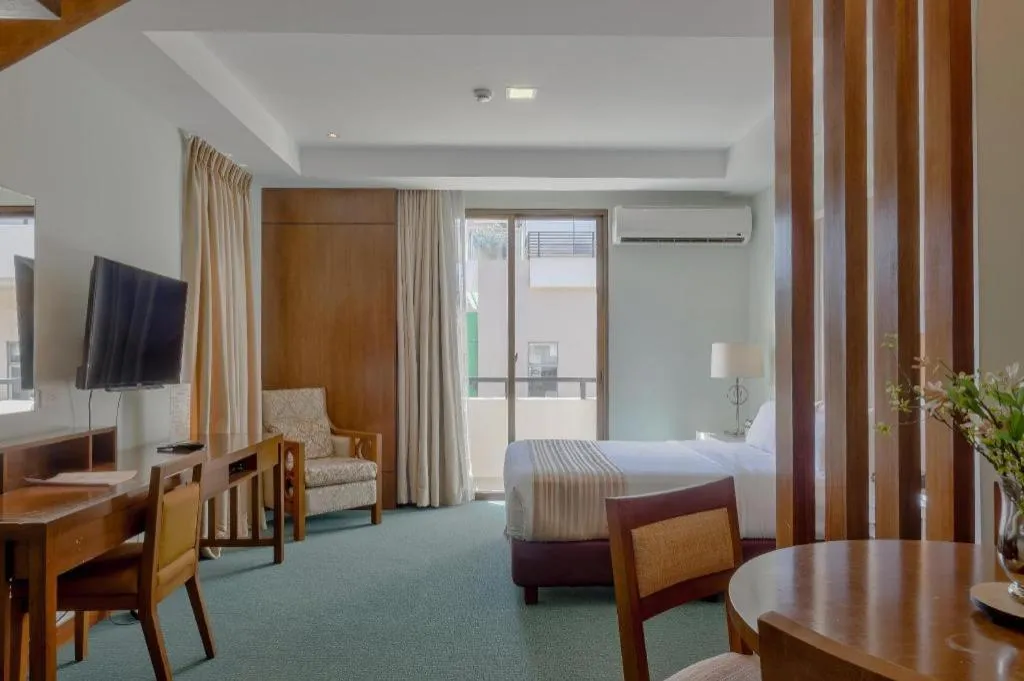 Bed in Mansion Garden Hotel