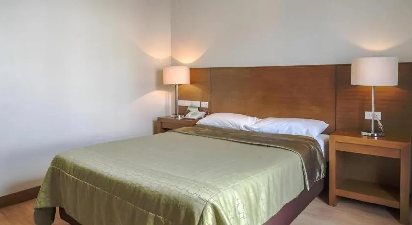 Bed in Mansion Garden Hotel