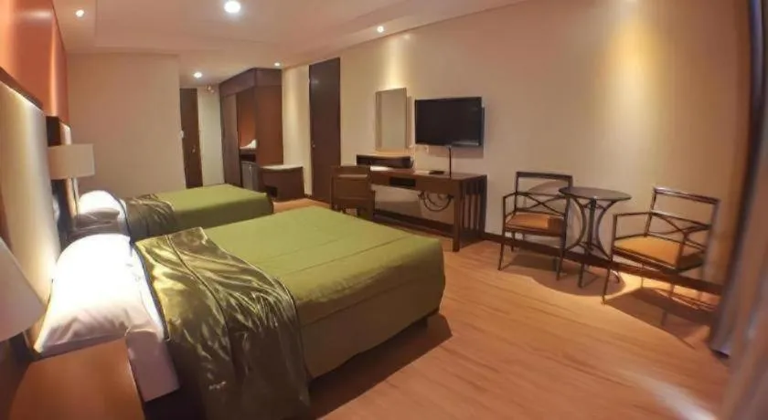 Bed in Mansion Garden Hotel