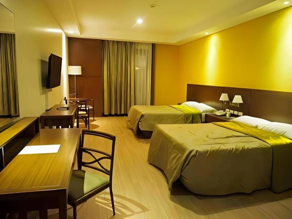 Bed in Mansion Garden Hotel