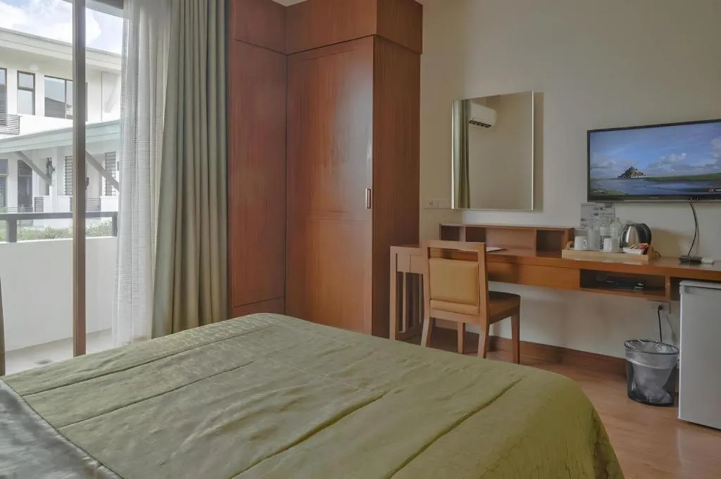 Bed in Mansion Garden Hotel