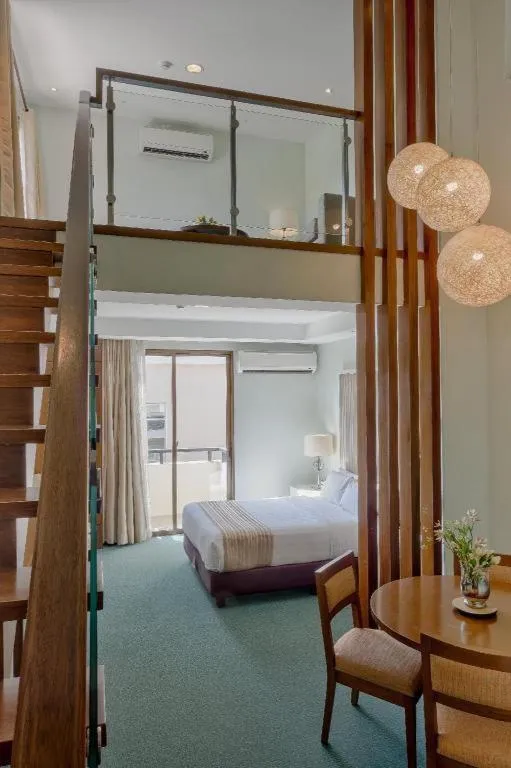 Bed in Mansion Garden Hotel