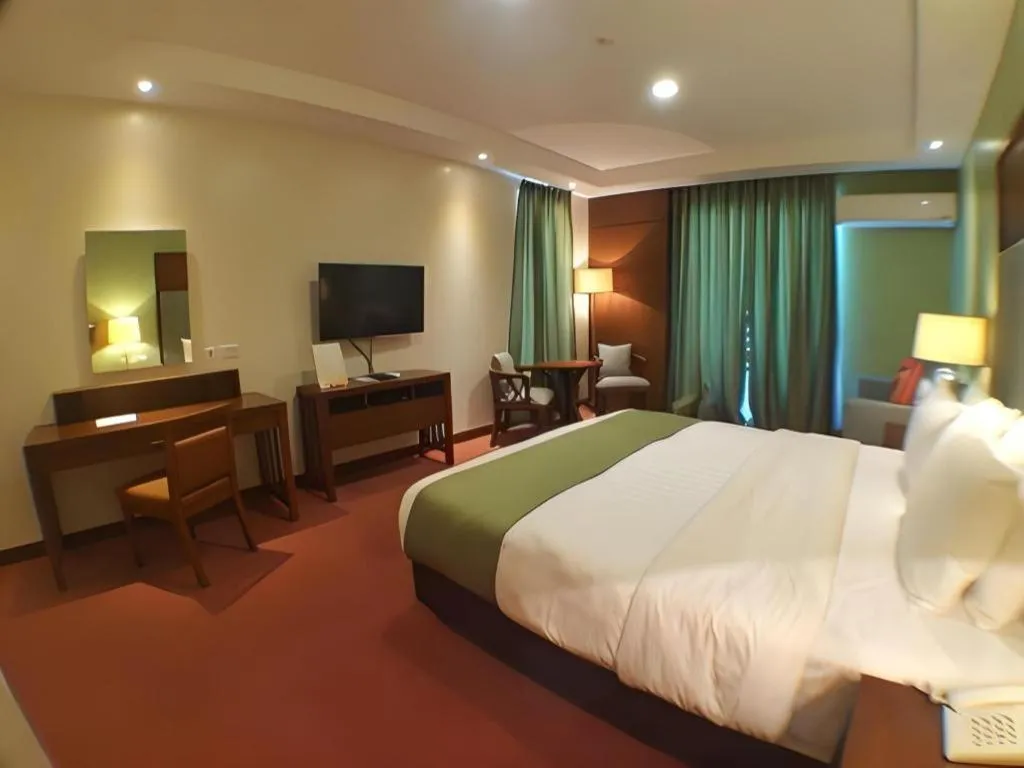 Bed in Mansion Garden Hotel