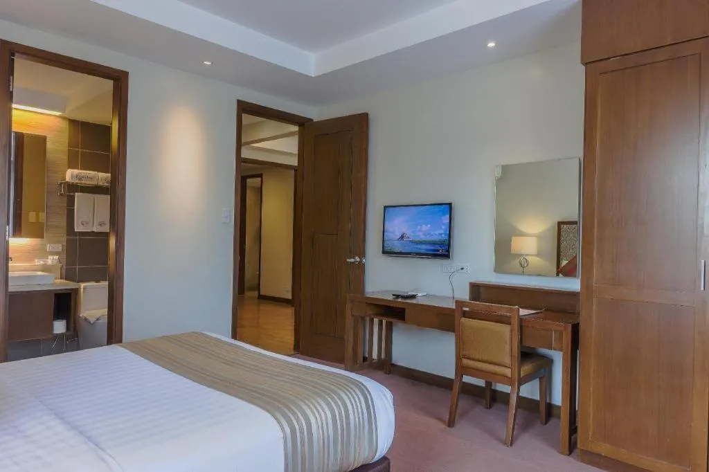 Bed in Mansion Garden Hotel