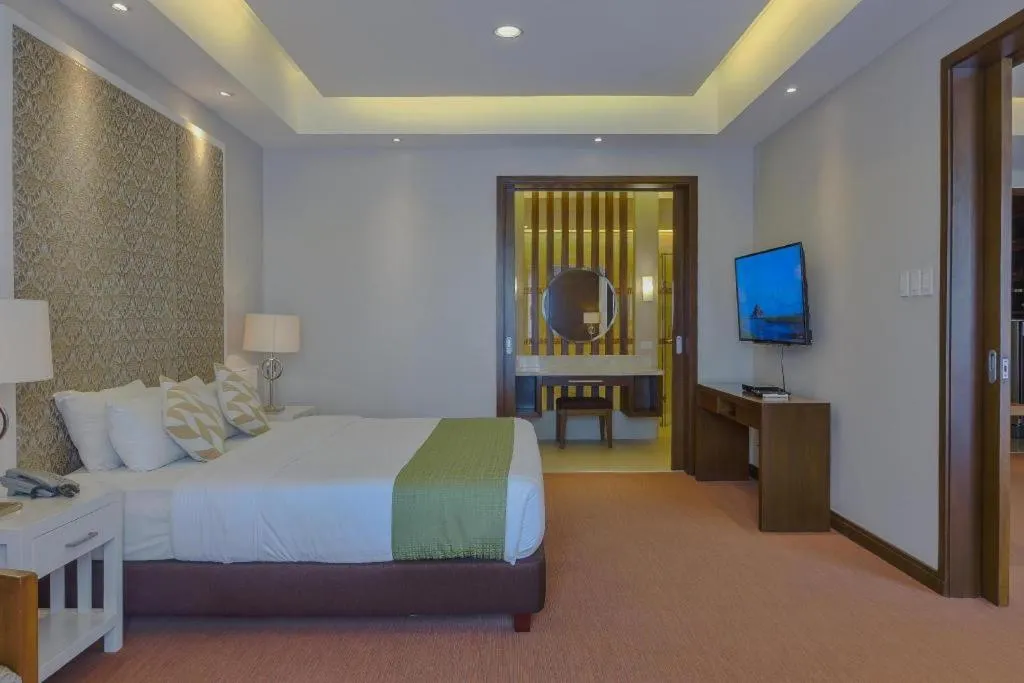 Bed in Mansion Garden Hotel