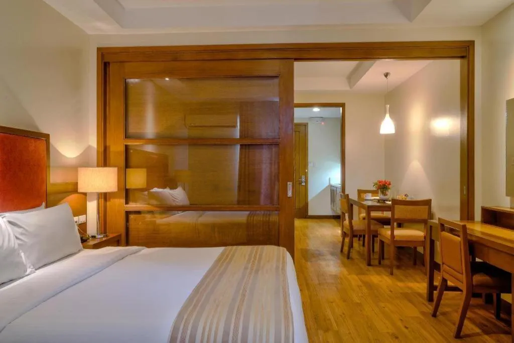 Bed in Mansion Garden Hotel