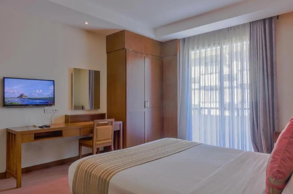 Bed in Mansion Garden Hotel