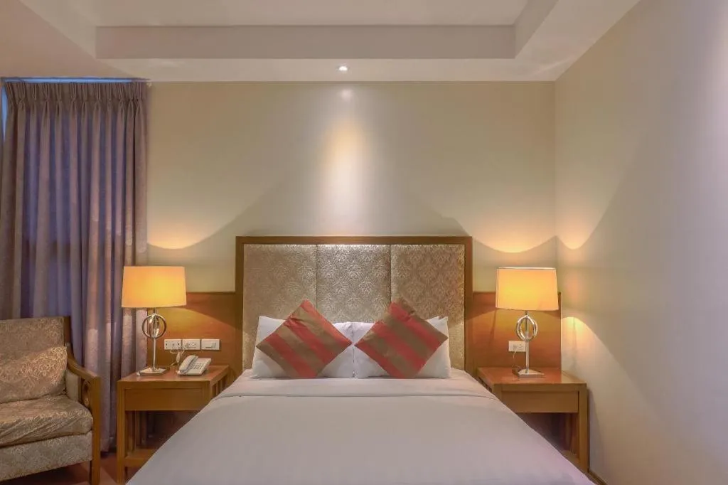 Bed in Mansion Garden Hotel