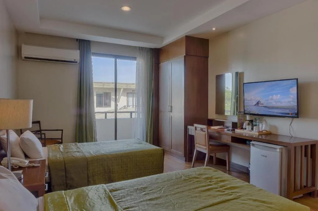 Bed in Mansion Garden Hotel