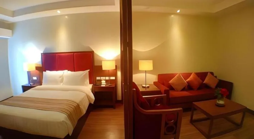 Bed in Mansion Garden Hotel