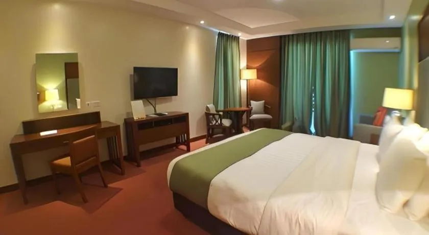 Bed in Mansion Garden Hotel