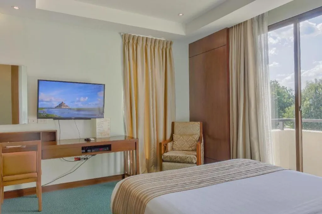 Bed in Mansion Garden Hotel