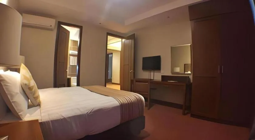 Bed in Mansion Garden Hotel