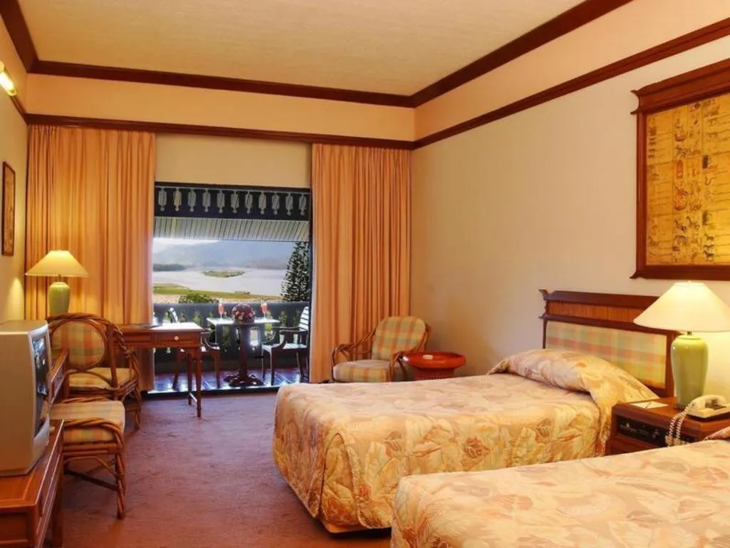 Bed in Imperial Golden Triangle Resort